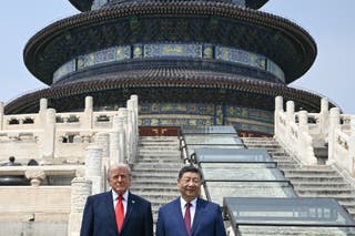 China's President Xi Jinping (R) and US President Donald Trump pose for a photo at the Temple of Heaven in Beijing